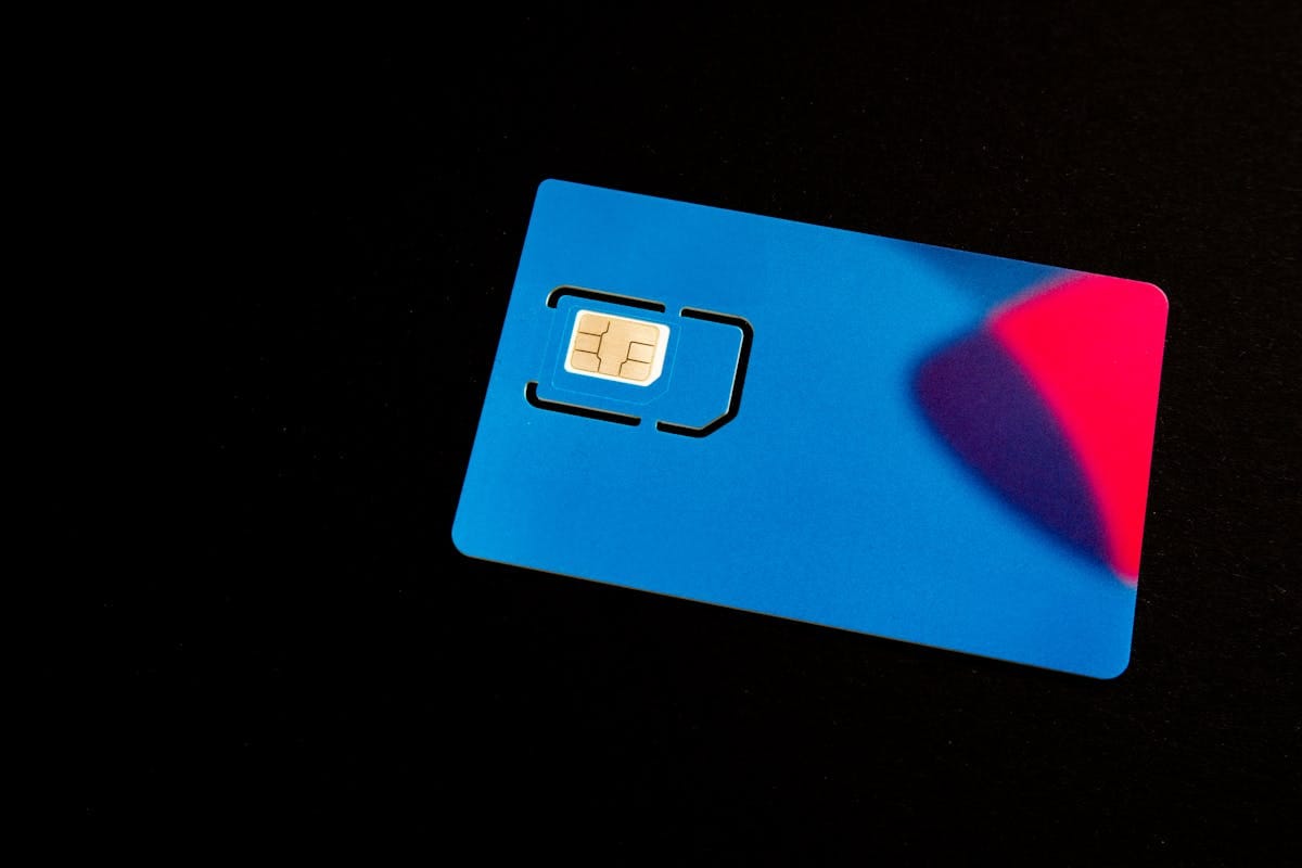 Close-up of a blue SIM card for UK mobile connectivity