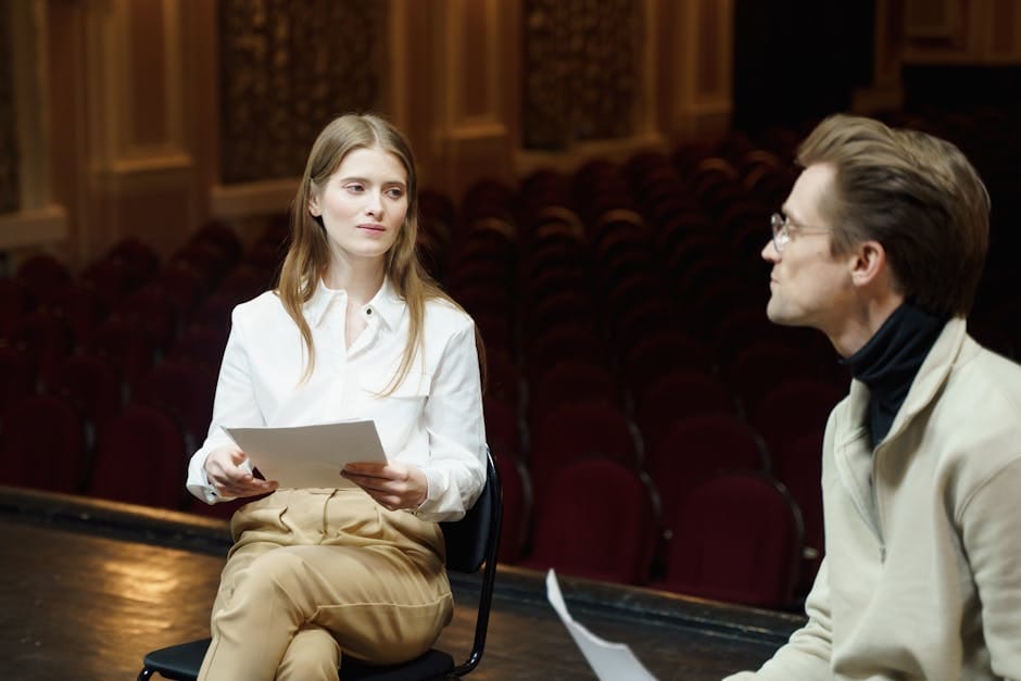 Stratford US travelers - man and woman rehearsing play script on theater stage