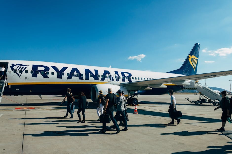 Passengers boarding an airline aircraft - codeshare flight to London