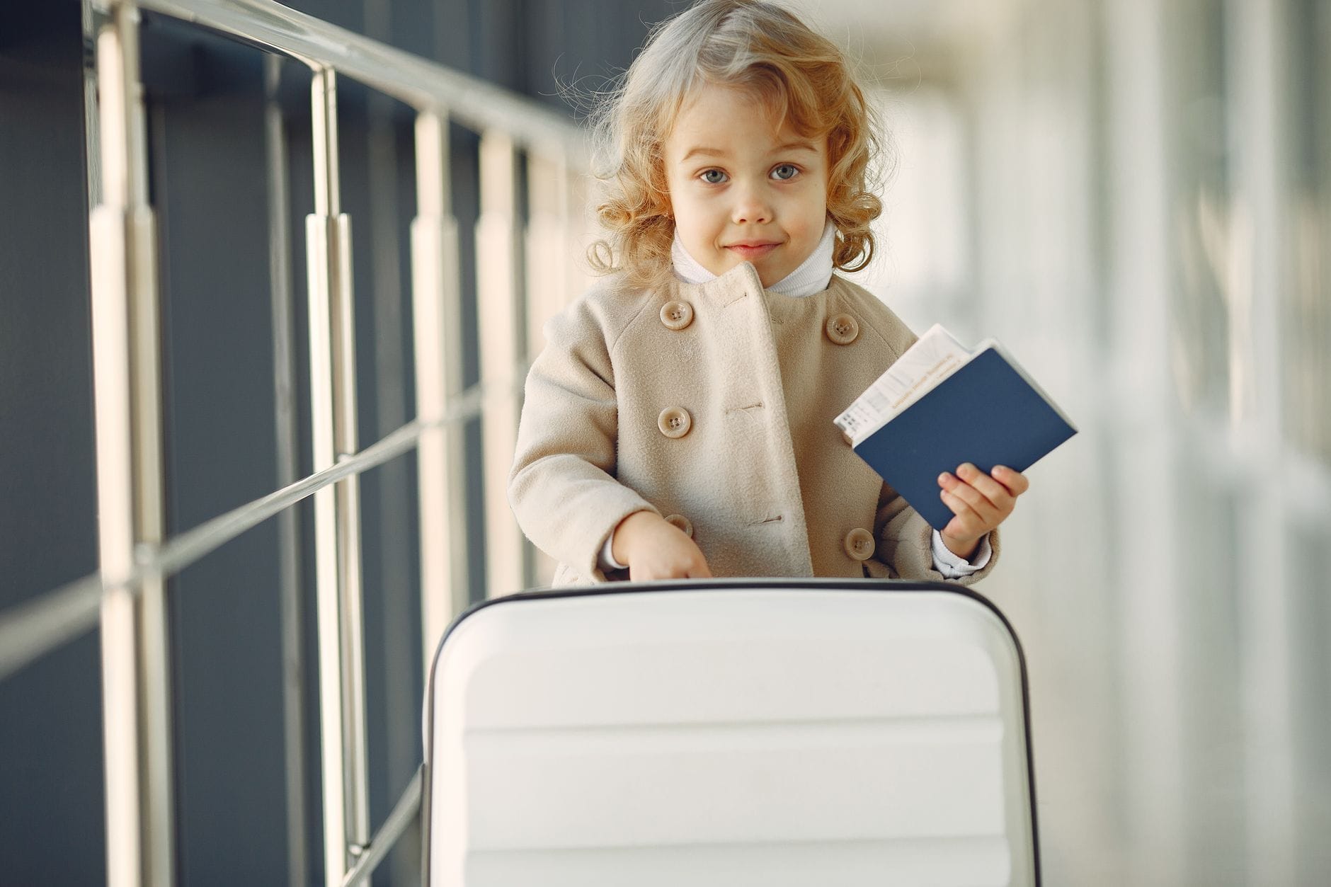 Child holding passport for travel