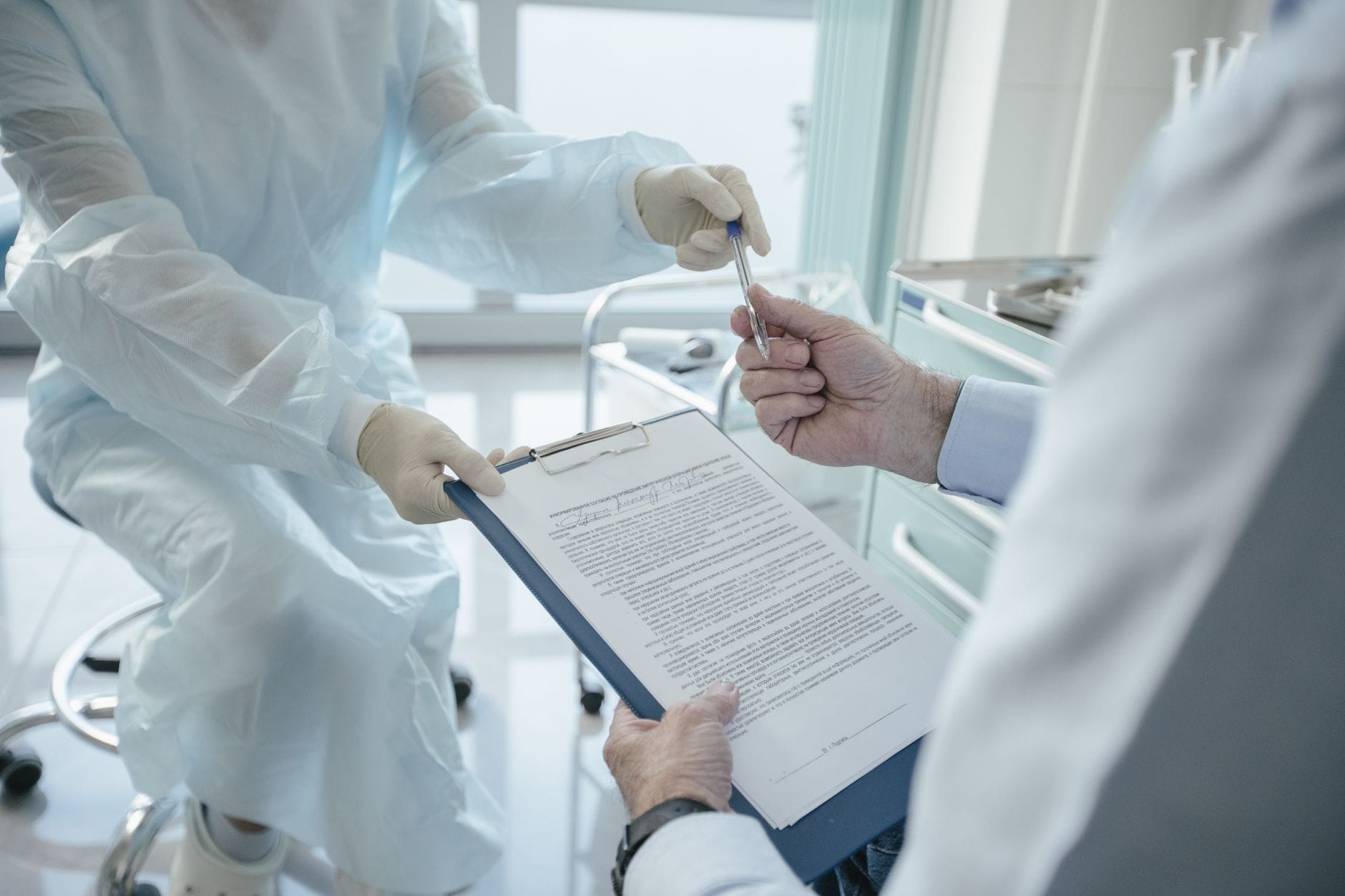 Doctor with medical form and clipboard