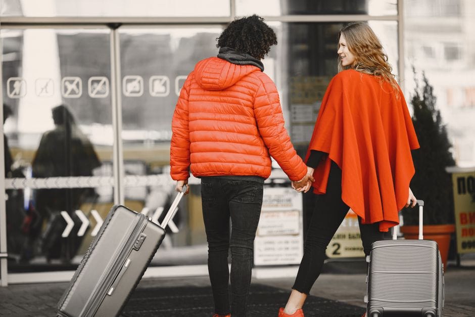 Senior traveler reviewing travel insurance documents before a flight