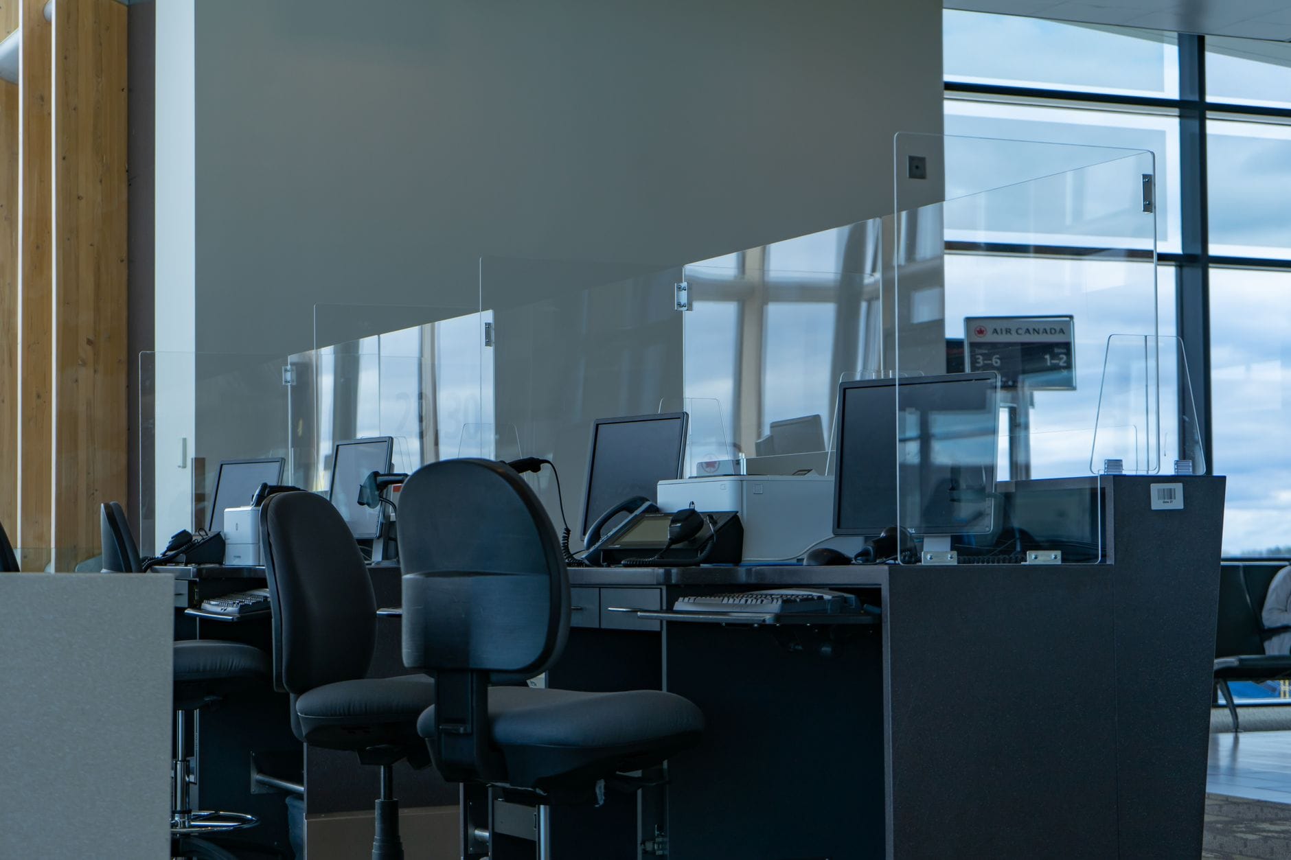 An airline check-in desk where staff may ask US travelers for onward travel proof