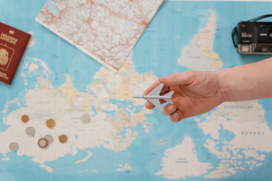 Traveler planning a UK ETA application with a passport and a wall calendar