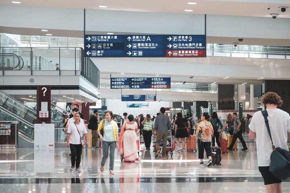 Diverse international travelers, some needing a UK ETA and others a visa