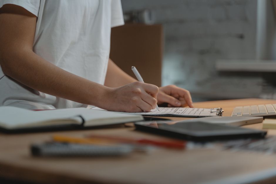 Organizer keeping a checklist of each traveler's UK ETA approval