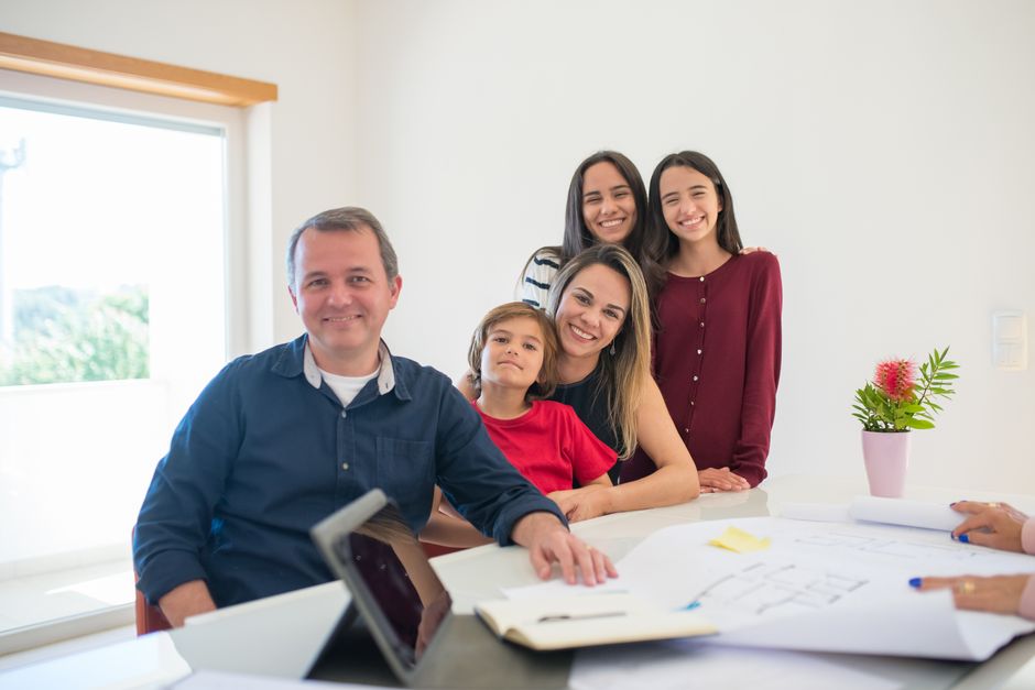 An adult applying for a UK ETA for family members on a laptop at home