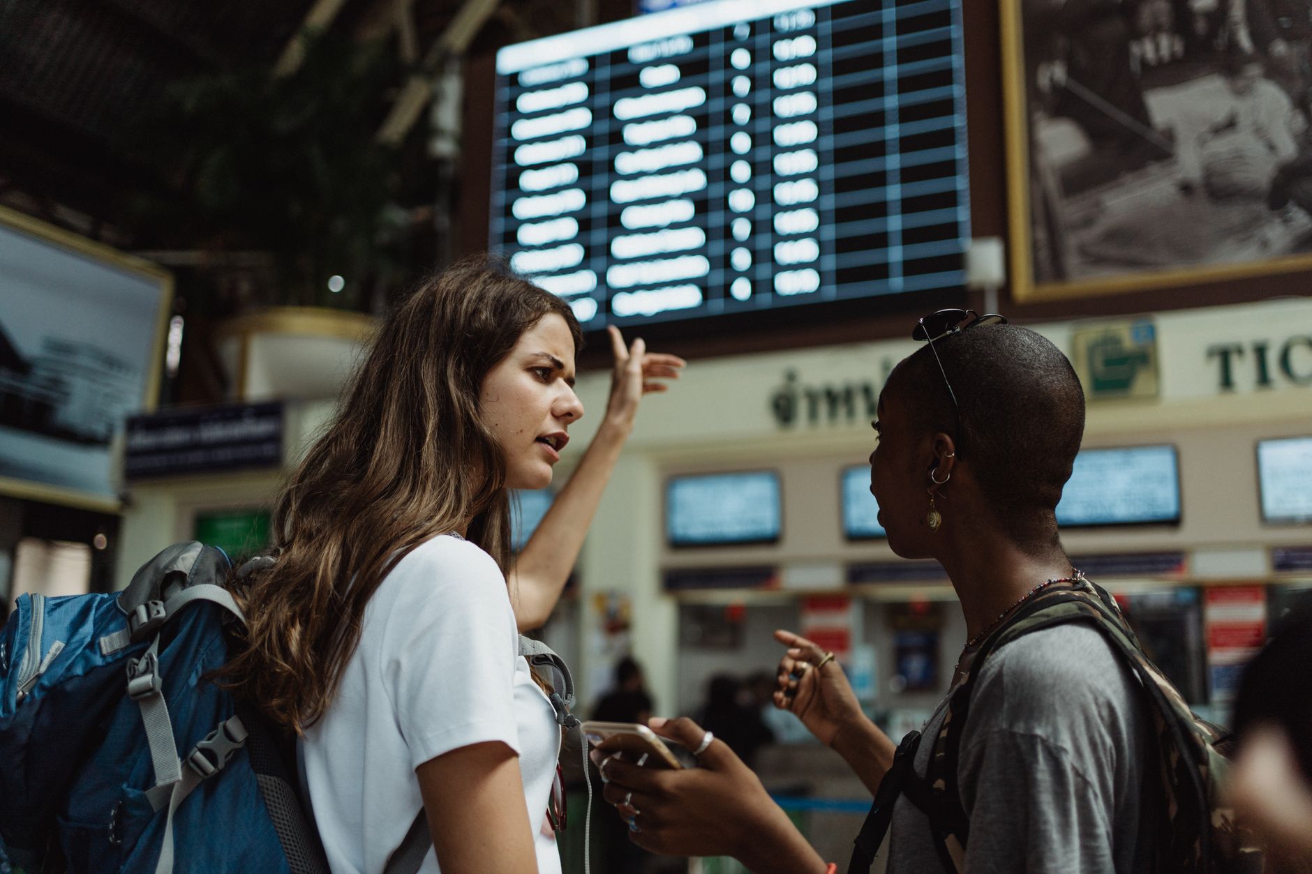 Traveler reviewing onward travel bookings on a phone before a UK trip