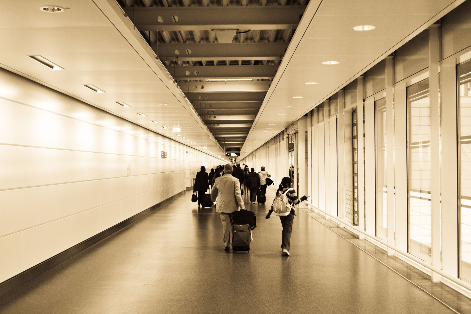 US family arriving at a UK airport to visit relatives and friends for a holiday